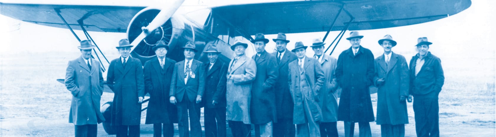 foth history - original team in front of airplane