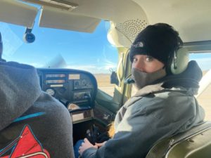 Engineer flies over project site in plane