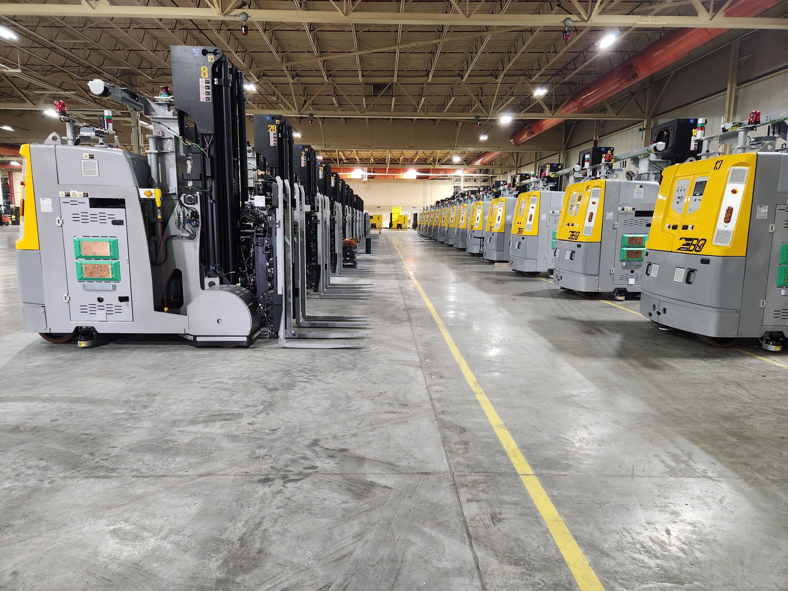 Rows of laser guided vehicles in a warehouse