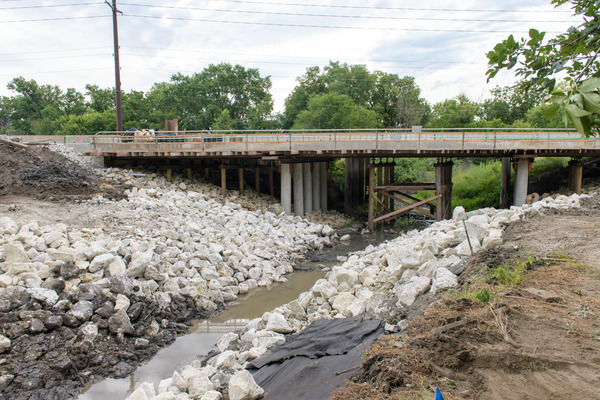 Ground level image of bridge under construction.